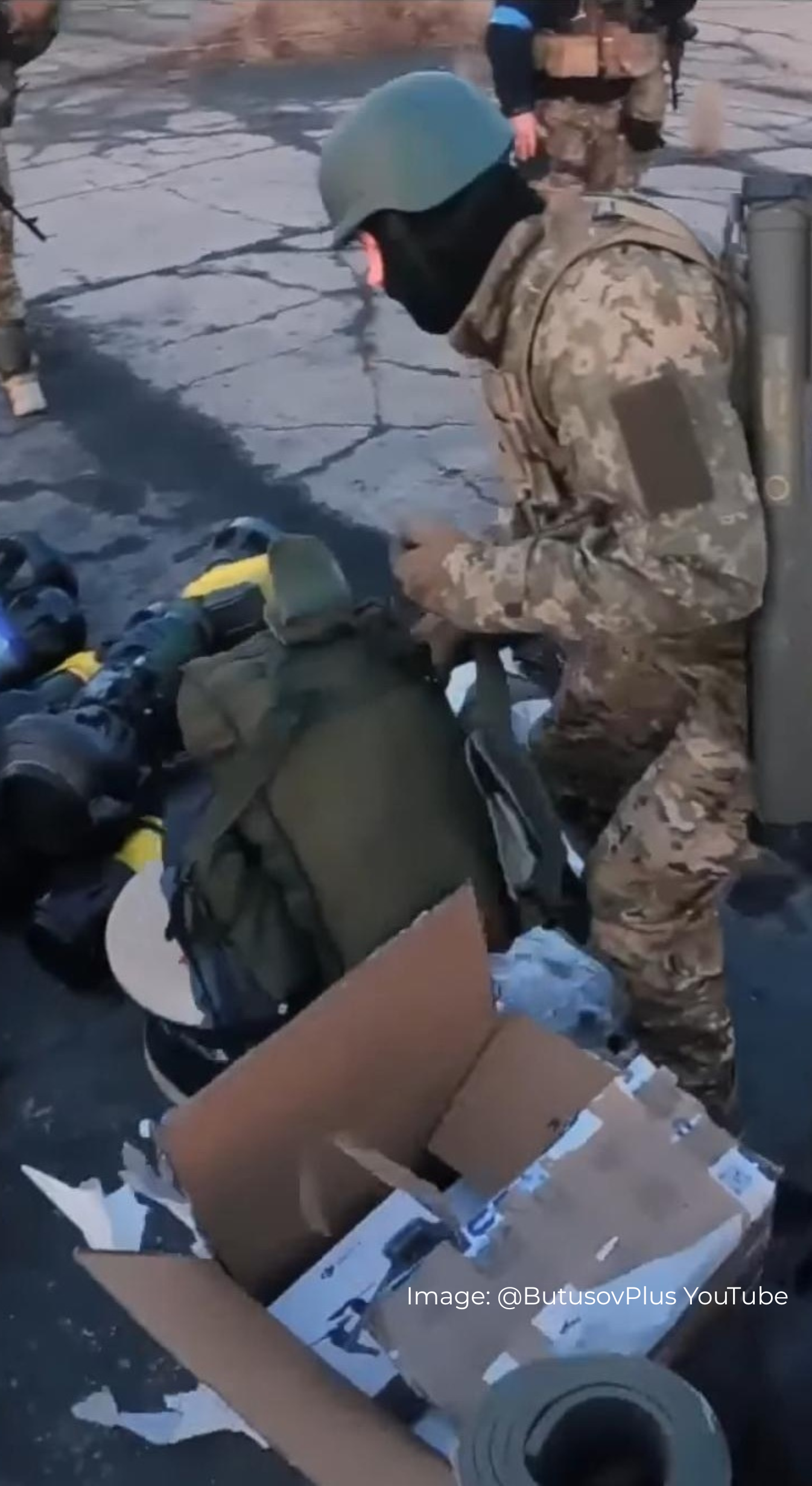 Ukrainian soldier in military camouflage outfit with A Savotta Kahakka backpack and other equipment on a stone surface