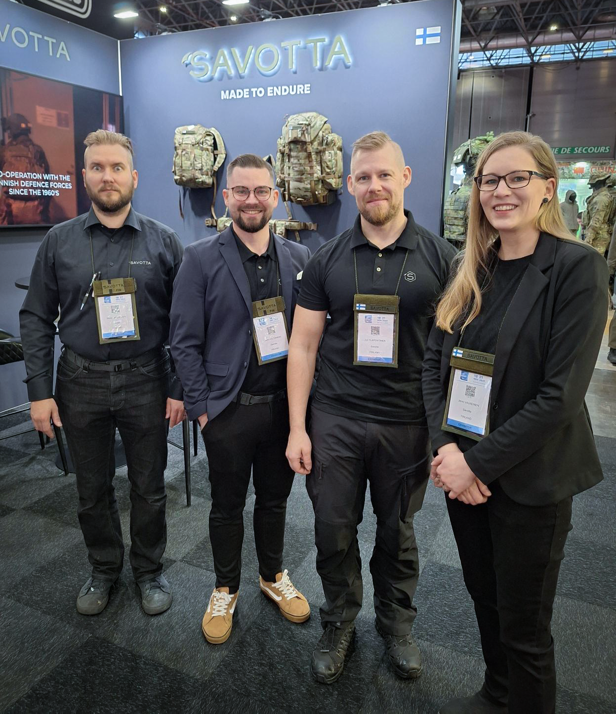 4 Savotta representatives standing in front of Savotta's booth at Milipol Paris 25