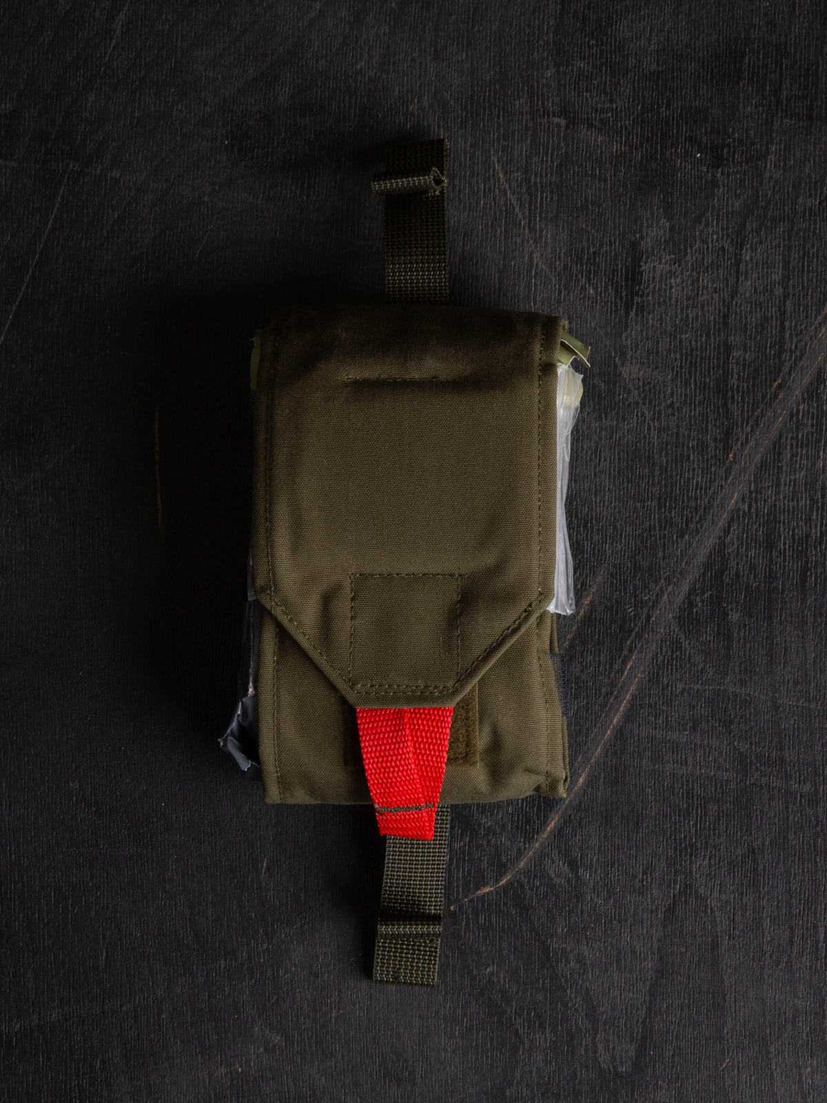 Full Savotta S-IFAK insert closed on a dark wooden surface