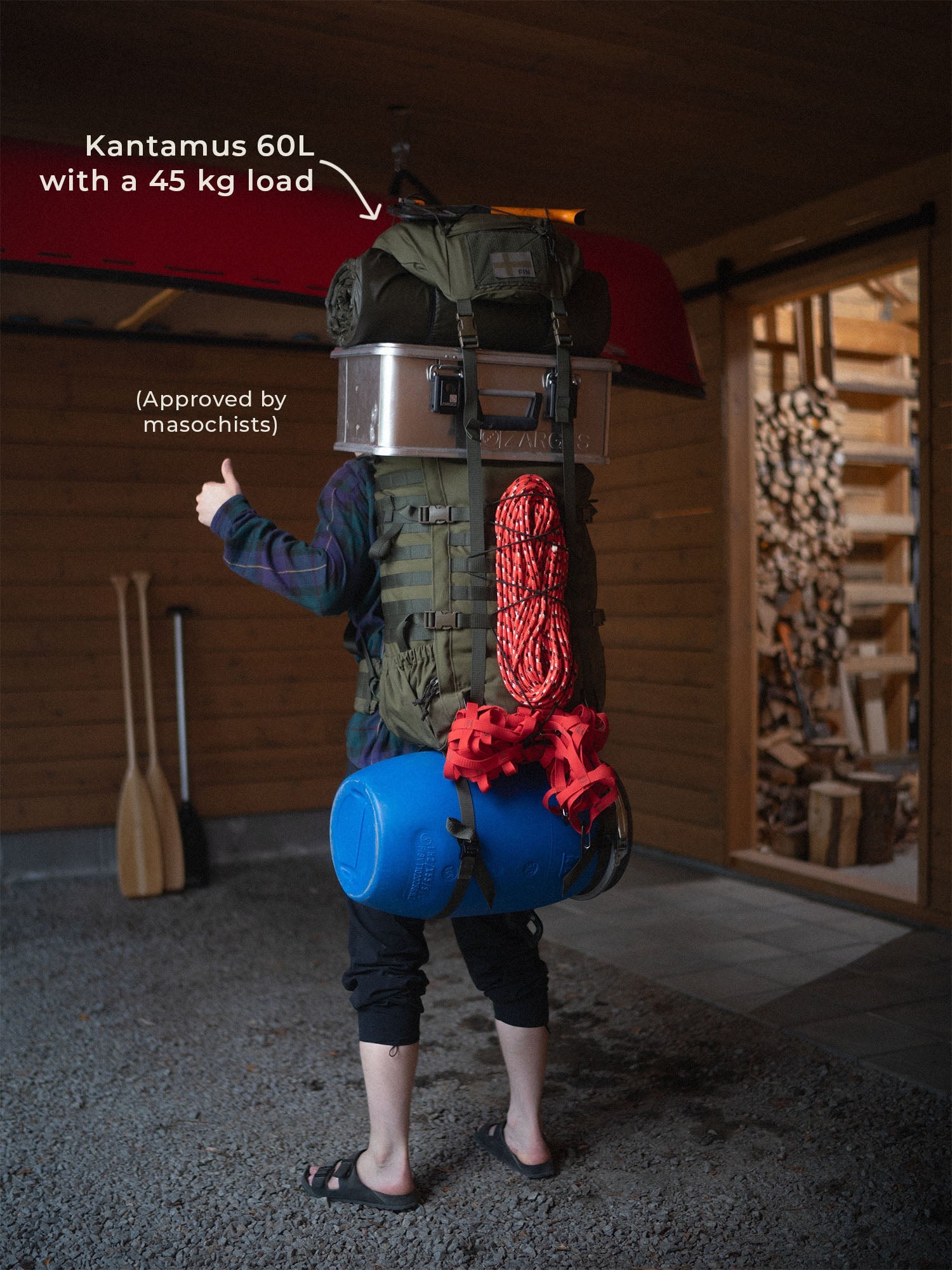 Person wearing a Savotta Kantamus 60L with a 45 kg load in a garage setting.