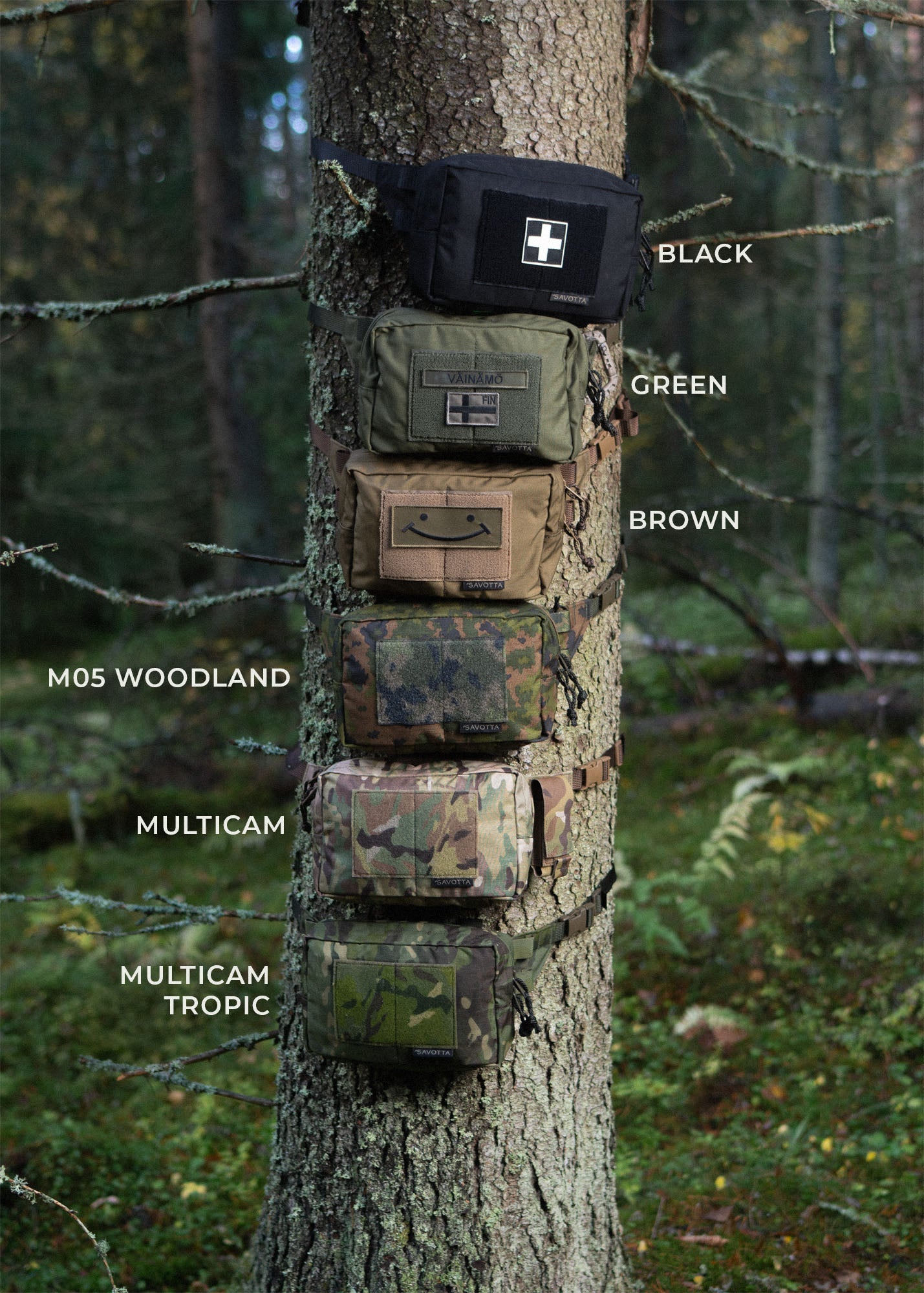 Six Savotta suur-kukkaros attached around a tree in a forest and showing the six different colour variants of the hip packs