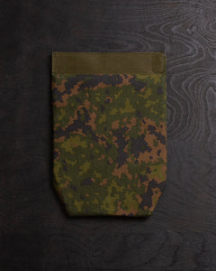 Savotta Varjelus groin flap from the back on a dark wooden surface