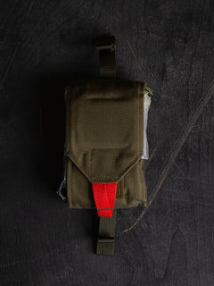 Full Savotta S-IFAK insert closed on a dark wooden surface