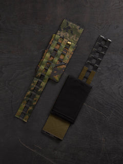 Savotta Varjelus plate carrier cummerbund with Varjelus side armour bags attached, photographed from the front and the back.