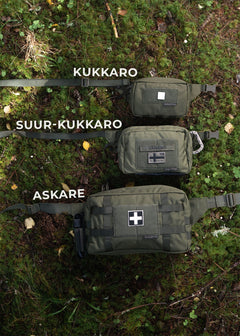 Three green Savotta hip packs labeled 'KUKKARO', 'SUUR-KUKKARO', and 'ASKARE' on a grassy background.