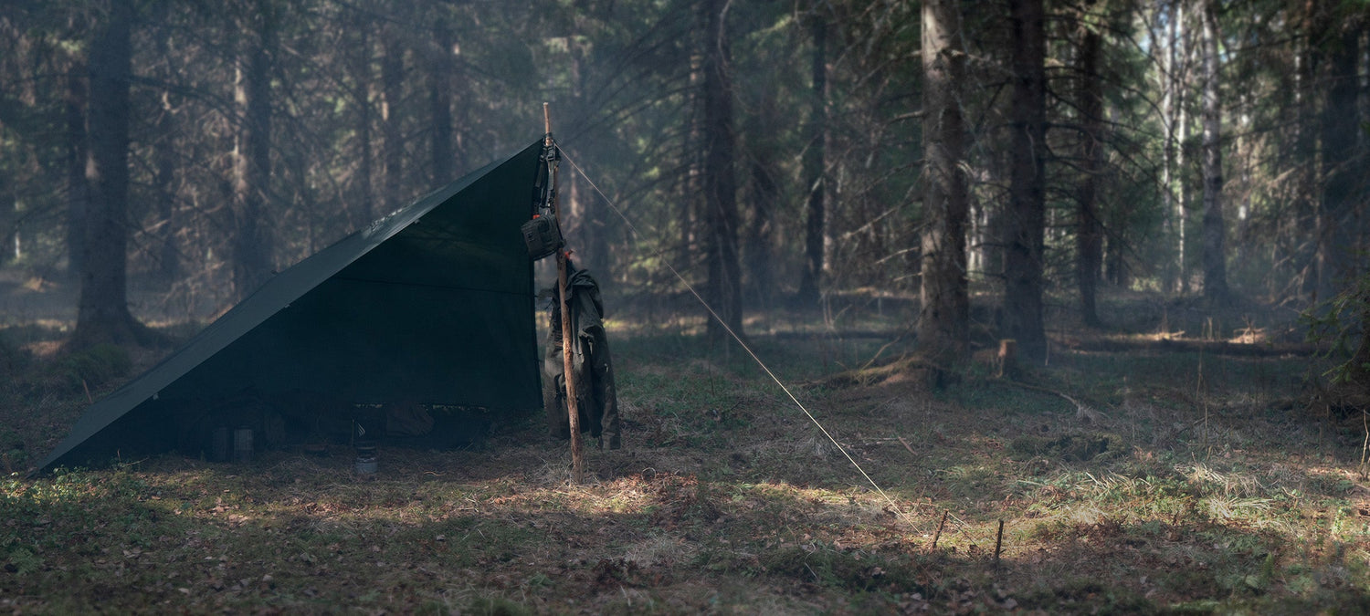 Green Savotta Laavu tarp in a sunny and foggy forest